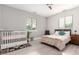Bright bedroom with ample natural light, featuring a ceiling fan and neutral decor at 2242 E Palm Ln, Phoenix, AZ 85006
