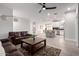 Spacious open-concept living area with a leather sofa and clear sight lines to the dining area and kitchen at 2242 E Palm Ln, Phoenix, AZ 85006