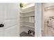 Bright pantry with organized shelving, providing ample storage space in a well-lit area with floral arrangement at 2242 E Palm Ln, Phoenix, AZ 85006