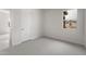 Bright bedroom features a window, a door, neutral carpet and neutral paint at 22523 E Orchard Ln, Queen Creek, AZ 85142