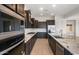 Well-equipped kitchen featuring stainless steel appliances, sleek cabinets, and granite countertops at 22523 E Orchard Ln, Queen Creek, AZ 85142