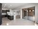 Spacious kitchen with island, stainless appliances, and sliding glass door to the backyard at 22523 E Orchard Ln, Queen Creek, AZ 85142