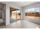 Bright living room with sliding glass doors and large windows, filling the space with natural light at 22523 E Orchard Ln, Queen Creek, AZ 85142