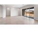 Bright living space featuring tile floors and a glass sliding door leading to the outside at 22523 E Orchard Ln, Queen Creek, AZ 85142