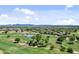 Expansive aerial view of the community and golf course with mountains in the distance at 23077 S 214Th St, Queen Creek, AZ 85142