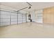 Spacious three car garage with built-in cabinets and epoxy flooring at 23077 S 214Th St, Queen Creek, AZ 85142