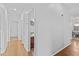 Hallway featuring light hardwood flooring and access to other rooms at 23077 S 214Th St, Queen Creek, AZ 85142