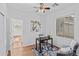 Bright home office with wood floors, simple decor, and lots of natural light at 23077 S 214Th St, Queen Creek, AZ 85142