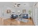 Bright and spacious living room with hardwood floors, a ceiling fan, and neutral paint at 23077 S 214Th St, Queen Creek, AZ 85142