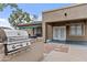 View of the outdoor kitchen and covered patio with ceiling fan at 23077 S 214Th St, Queen Creek, AZ 85142