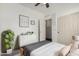 A soothing bedroom with white walls, a gray blanket, a large closet, and lots of bright, natural light at 3354 E Thornton Ave, Gilbert, AZ 85297