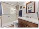 Bathroom featuring a walk-in shower with bench and vanity with storage at 3505 E South Fork Dr, Phoenix, AZ 85044