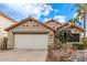 Charming single-story home featuring a well-manicured yard, two-car garage, and a classic Southwestern-style design at 3505 E South Fork Dr, Phoenix, AZ 85044