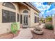 Close up of front entrance featuring a charming courtyard, desert landscaping, and cozy outdoor seating area at 3505 E South Fork Dr, Phoenix, AZ 85044