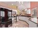 Modern kitchen featuring white cabinets, granite countertops, stainless steel appliances, and an open layout at 3505 E South Fork Dr, Phoenix, AZ 85044