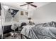 Bedroom features a ceiling fan and window with a view at 36480 W El Greco St, Maricopa, AZ 85138