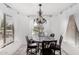 Inviting dining room with a chandelier, neutral paint, and lots of natural light at 36480 W El Greco St, Maricopa, AZ 85138