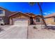 Charming single-story home featuring a two-car garage and desert landscaping in a quiet neighborhood at 36480 W El Greco St, Maricopa, AZ 85138