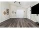 Open living room showcasing new flooring, vaulted ceilings, and access to the backyard at 36480 W El Greco St, Maricopa, AZ 85138