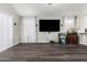Bright living room featuring new flooring, vaulted ceilings, and an entertainment area at 36480 W El Greco St, Maricopa, AZ 85138