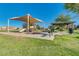 Community playground featuring shaded picnic areas and play equipment, offering a great space for and families at 36480 W El Greco St, Maricopa, AZ 85138