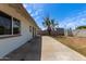 Expansive backyard with a concrete patio, providing space for outdoor entertaining and relaxing at 3826 W Davidson Ln, Phoenix, AZ 85051