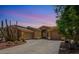 Charming single-story home with desert landscaping, a tile roof, and a spacious driveway at 4667 E County Down Dr, Chandler, AZ 85249