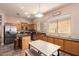 Modern kitchen with stainless steel appliances, wood cabinets, and a breakfast bar seating at 4667 E County Down Dr, Chandler, AZ 85249