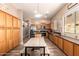 Well-lit kitchen with stainless steel appliances, ample cabinetry, and a large dining table at 4667 E County Down Dr, Chandler, AZ 85249