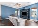 Bright living room with media center, comfortable seating, and warm natural light at 4667 E County Down Dr, Chandler, AZ 85249