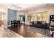Bright living room featuring hardwood floors and comfortable seating, with lots of natural light at 4667 E County Down Dr, Chandler, AZ 85249