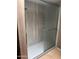 Bathroom features a glass shower door, modern shower head, and shelving at 4775 W Mission Ln, Glendale, AZ 85302