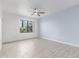 Bedroom with tile flooring, a ceiling fan, and a window providing ample natural light at 5302 E Van Buren St # 2015, Phoenix, AZ 85008