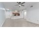Open floor plan showcasing a living room with tile floors flowing into the kitchen area at 5302 E Van Buren St # 2015, Phoenix, AZ 85008