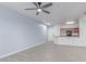 Spacious living area with tile flooring, seamlessly connected to the kitchen, enhancing the open layout at 5302 E Van Buren St # 2015, Phoenix, AZ 85008