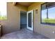 Outdoor patio with tiled floor and view into the bedroom and balcony at 5302 E Van Buren St # 2015, Phoenix, AZ 85008