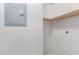 Bright unfinished storage room with electrical box and built-in shelf at 5302 E Van Buren St # 2015, Phoenix, AZ 85008