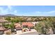 Inviting aerial view of a desert community featuring meticulously landscaped homes, terracotta roofs, and mature trees for appeal at 5332 S Citrus Ct, Gilbert, AZ 85298