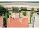 An aerial view of a home with a red tiled roof, covered patio, and desert landscaping at 5332 S Citrus Ct, Gilbert, AZ 85298