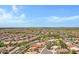 Panoramic aerial view of a sprawling residential area, showcasing neatly arranged homes with verdant landscaping and winding roads at 5332 S Citrus Ct, Gilbert, AZ 85298