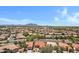 Scenic aerial shot showcases homes in a well-planned desert community, highlighted by terracotta roofs and lush landscaping at 5332 S Citrus Ct, Gilbert, AZ 85298