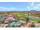 A sprawling aerial view showing a community center, golf course, and swimming pool at 5332 S Citrus Ct, Gilbert, AZ 85298