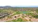 Beautiful aerial view of a golf course community with lush green fairways, ponds, and residential homes at 5332 S Citrus Ct, Gilbert, AZ 85298