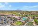 A sprawling aerial view showing a community center, golf course, and swimming pool at 5332 S Citrus Ct, Gilbert, AZ 85298