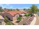A beautiful home featuring a landscaped backyard with a covered patio and desert plants at 5332 S Citrus Ct, Gilbert, AZ 85298