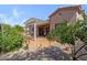 Backyard features a covered patio, desert landscaping, and citrus tree at 5332 S Citrus Ct, Gilbert, AZ 85298