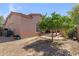 Backyard features a covered patio, desert landscaping, and citrus tree at 5332 S Citrus Ct, Gilbert, AZ 85298