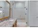 Bathroom features a glass-enclosed shower, a granite countertop, and a sink with a brushed nickel faucet at 5332 S Citrus Ct, Gilbert, AZ 85298