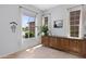 Bright dining area with three windows, neutral walls, and custom-built cabinetry at 5332 S Citrus Ct, Gilbert, AZ 85298