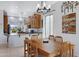 This dining room provides a charming chandelier and a wooden table with seating for six at 5332 S Citrus Ct, Gilbert, AZ 85298